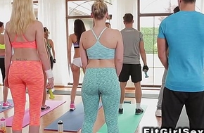 Lesbians in legging tribbing in the gym